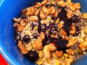 Oatmeal with lots of nuts and seeds, blackstrap molasses, and some thawed frozen blueberries.